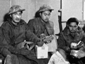 28th (Māori) Battalion members unwrapping their Christmas parcels, Faenza, Italy, 1944.