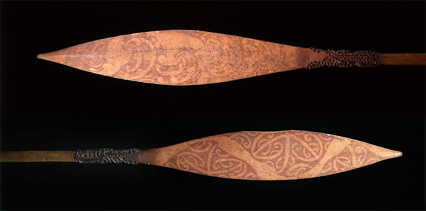 Two carved paddles